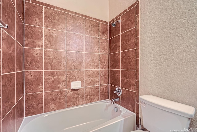 2253 Sun Stone, New Braunfels, TX 78130 - bathroom with toilet, shower / tub combination, and a textured wall