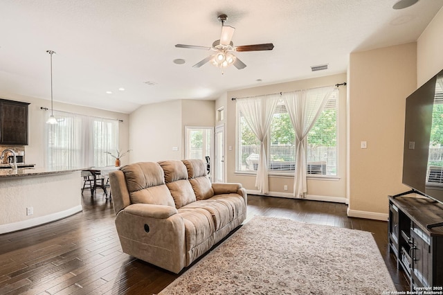 2253 Sun Stone, New Braunfels, TX 78130 - living area featuring dark wood finished floors, visible vents, a ceiling fan, and a healthy amount of sunlight