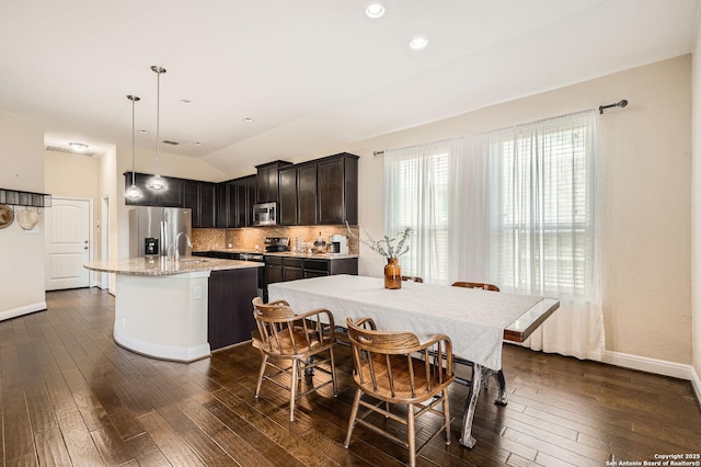 2253 Sun Stone, New Braunfels, TX 78130 - dining space featuring baseboards, lofted ceiling, and dark wood-style floors