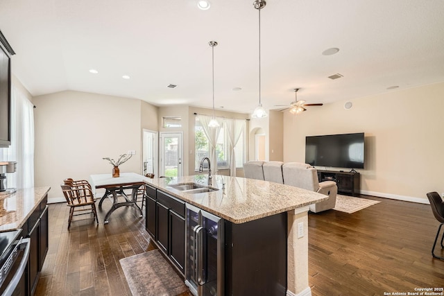 2253 Sun Stone, New Braunfels, TX 78130 - kitchen with beverage cooler, a sink, dark wood finished floors, baseboards, and electric stove