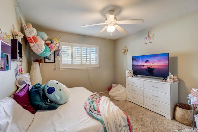 carpeted bedroom featuring a ceiling fan