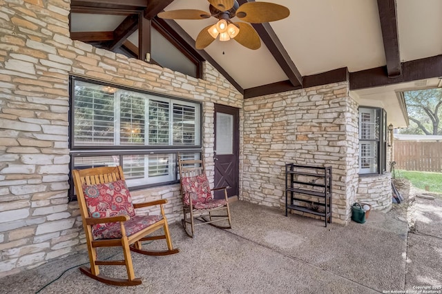 view of patio / terrace with ceiling fan and fence