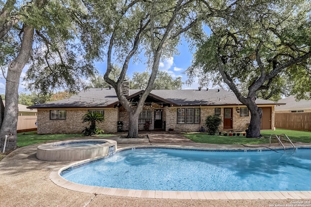 view of pool featuring a pool with connected hot tub