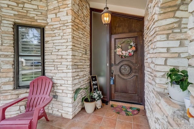 doorway to property with covered porch
