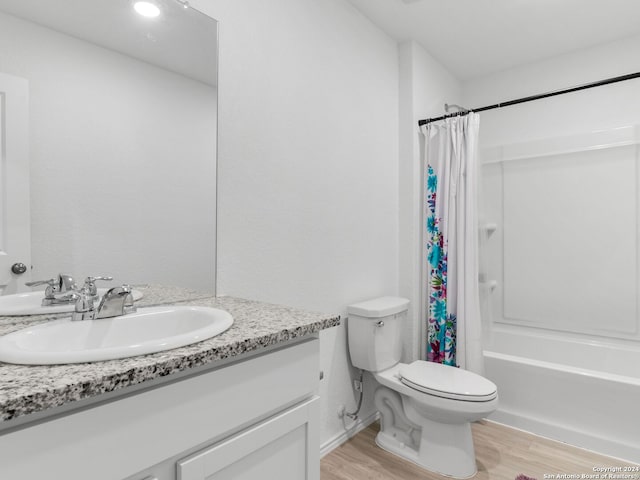 2834 Millikan Dr, Converse, TX 78109 - bathroom with vanity, toilet, shower / bath combination with curtain, and wood finished floors