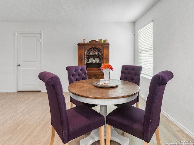 2834 Millikan Dr, Converse, TX 78109 - dining space featuring light wood finished floors and baseboards