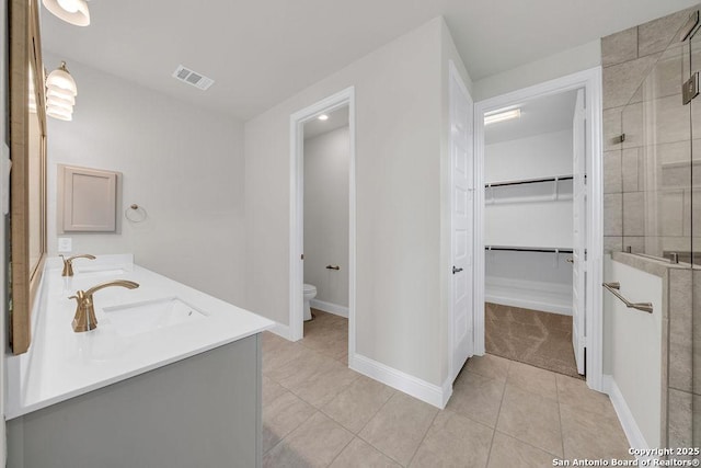 5303 Pinder Way, Schertz, TX 78108 - full bath with a stall shower, toilet, visible vents, a sink, and tile patterned floors