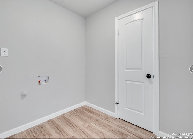 washroom with laundry area, light wood-style flooring, baseboards, and washer hookup