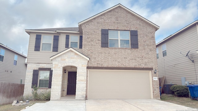 8411 Puente, San Antonio, TX 78223 - traditional-style home with central air condition unit, fence, an attached garage, stone siding, and concrete driveway