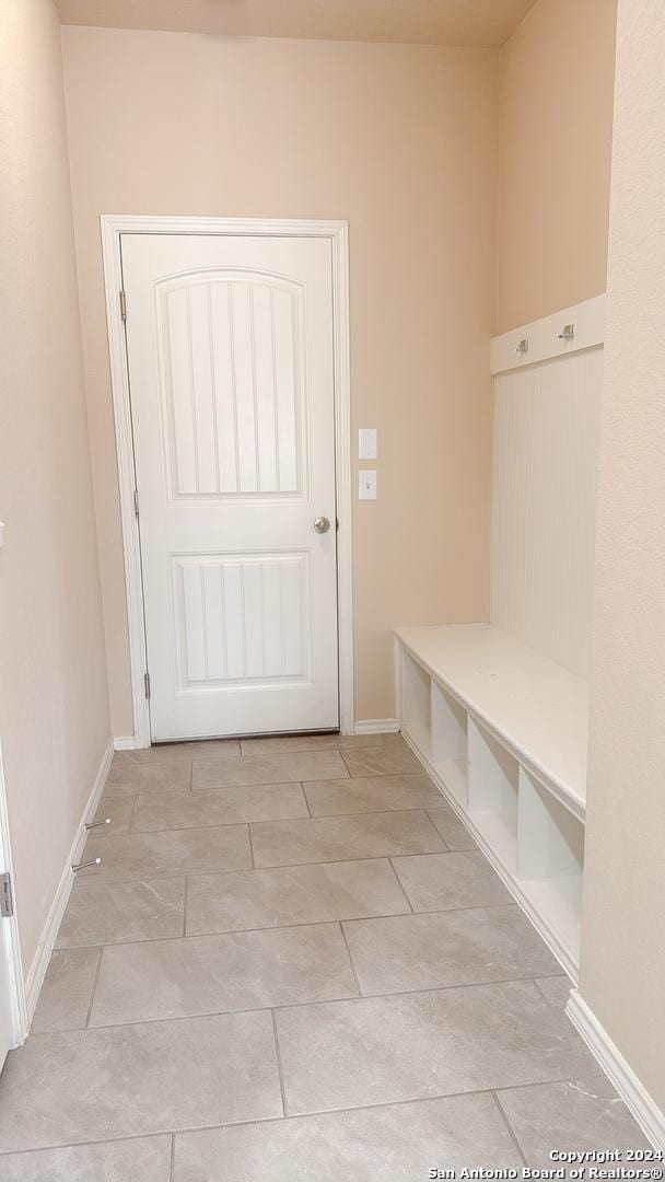 8411 Puente, San Antonio, TX 78223 - mudroom featuring baseboards and light tile patterned flooring