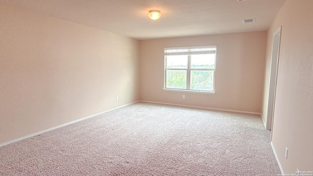 8411 Puente, San Antonio, TX 78223 - empty room with visible vents, baseboards, and light carpet