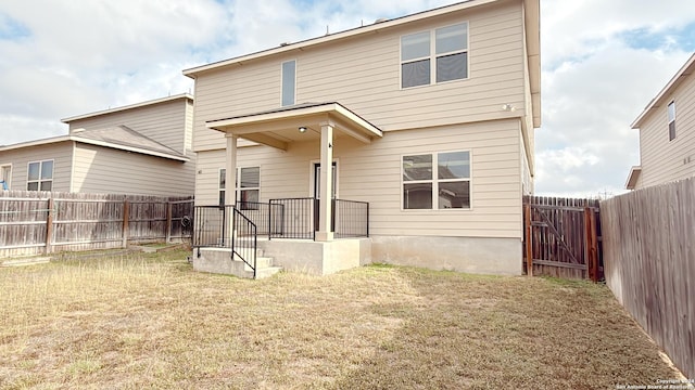 8411 Puente, San Antonio, TX 78223 - back of property featuring a fenced backyard and a lawn