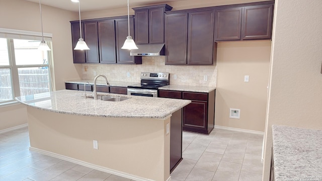 8411 Puente, San Antonio, TX 78223 - kitchen featuring under cabinet range hood, stainless steel electric range, a sink, backsplash, and a center island with sink
