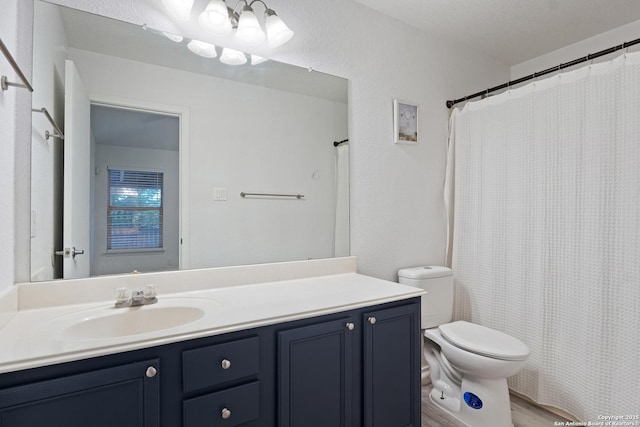 full bath with toilet and vanity