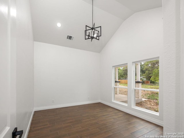 interior space featuring baseboards, dark wood finished floors, visible vents, and high vaulted ceiling