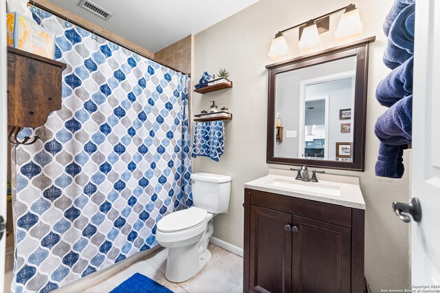 503 Lower Lacoste, Castroville, TX 78009 - full bathroom with toilet, tile patterned floors, visible vents, baseboards, and vanity