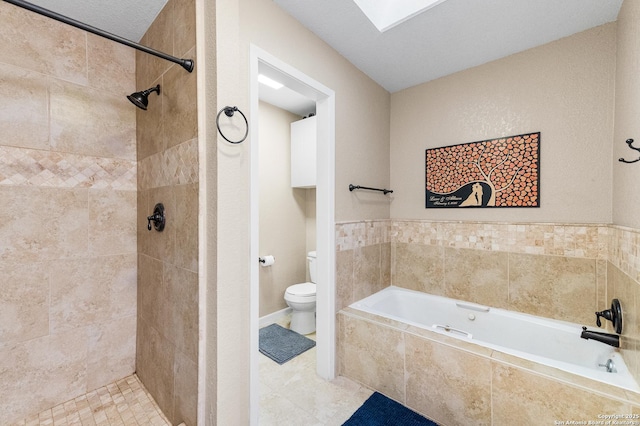 503 Lower Lacoste, Castroville, TX 78009 - bathroom with a skylight, toilet, a bath, and a tile shower