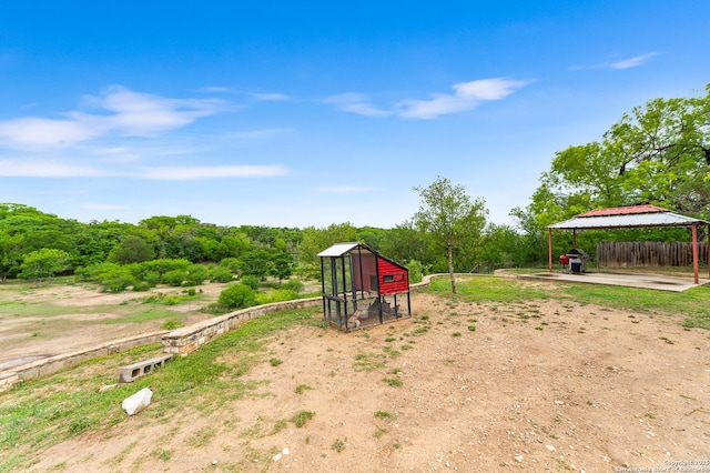 503 Lower Lacoste, Castroville, TX 78009 - exterior space featuring exterior structure, fence, a carport, a gazebo, and an outbuilding
