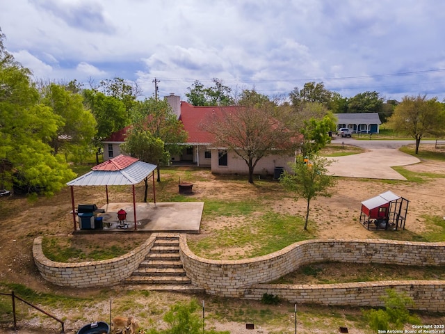 503 Lower Lacoste, Castroville, TX 78009 - exterior space featuring a gazebo, a patio area, and a chimney