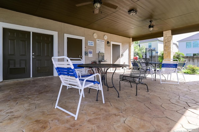 view of patio / terrace featuring ceiling fan, outdoor dining area, and fence