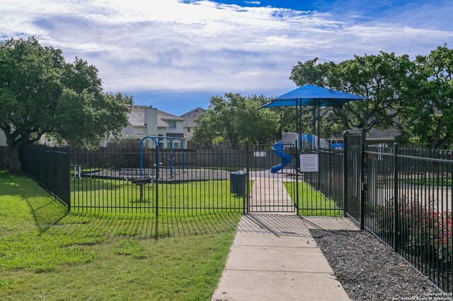 view of home's community featuring a gate