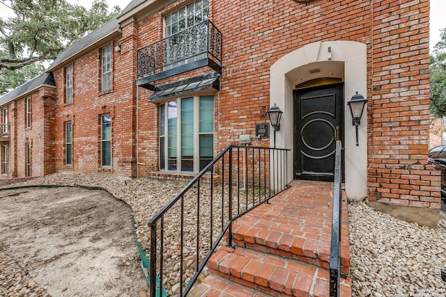 7500 Callaghan Rd Unit 172, San Antonio, TX 78229 - entrance to property with brick siding and a balcony