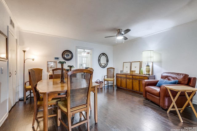 7500 Callaghan Rd Unit 172, San Antonio, TX 78229 - dining room with crown molding, visible vents, ceiling fan, and dark wood-style floors