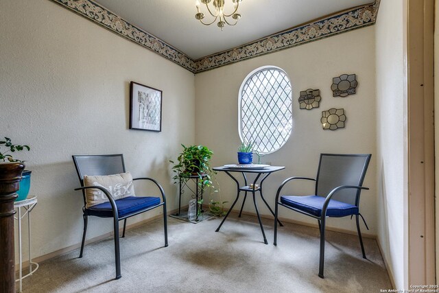 7500 Callaghan Rd Unit 172, San Antonio, TX 78229 - sitting room with carpet, baseboards, and a notable chandelier