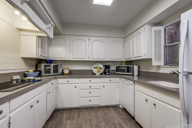 7500 Callaghan Rd Unit 172, San Antonio, TX 78229 - kitchen with white appliances, white cabinets, a toaster, and a sink