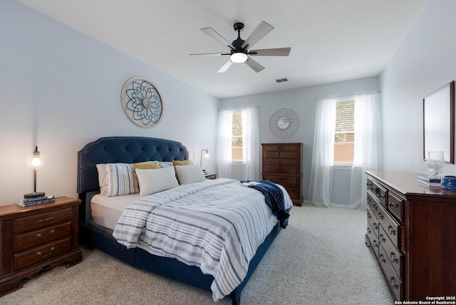 190 Da Vinci, San Antonio, TX 78258 - bedroom with light carpet, multiple windows, and a ceiling fan