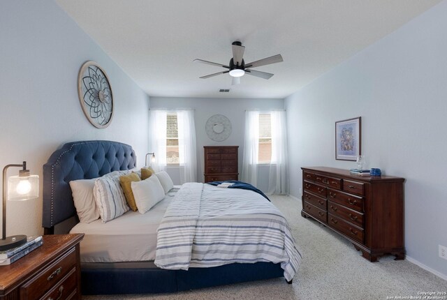 190 Da Vinci, San Antonio, TX 78258 - bedroom with light colored carpet, a ceiling fan, and baseboards