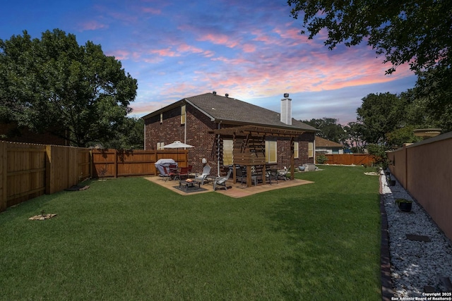 190 Da Vinci, San Antonio, TX 78258 - back of house featuring an outdoor fire pit, a chimney, a patio, and brick siding