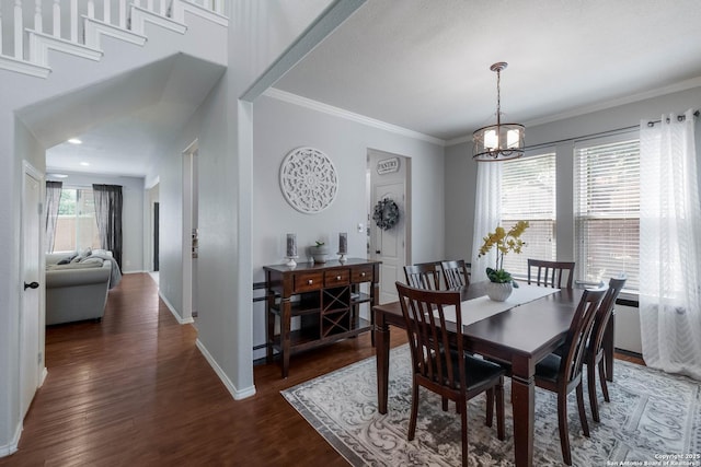 190 Da Vinci, San Antonio, TX 78258 - dining area featuring wood finished floors, crown molding, baseboards, and a chandelier