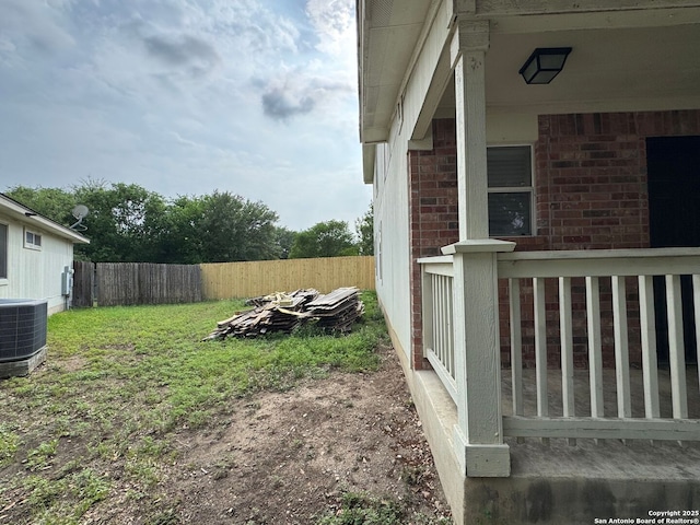 view of yard featuring central AC unit and a fenced backyard