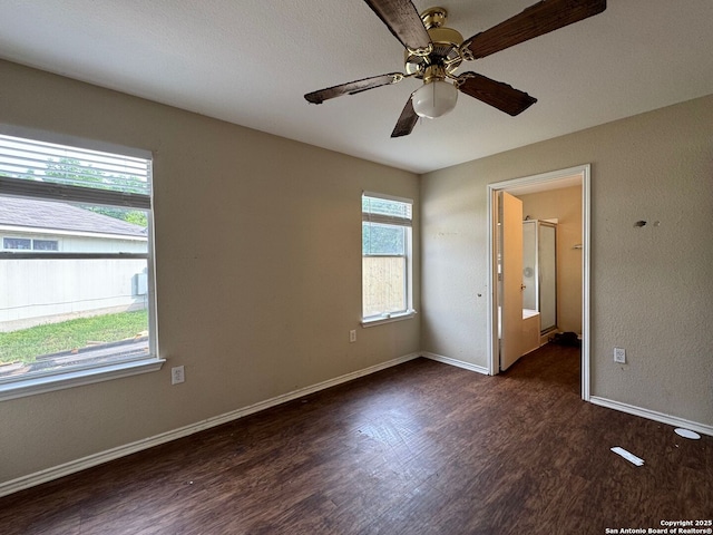 unfurnished room featuring baseboards, ceiling fan, and wood finished floors