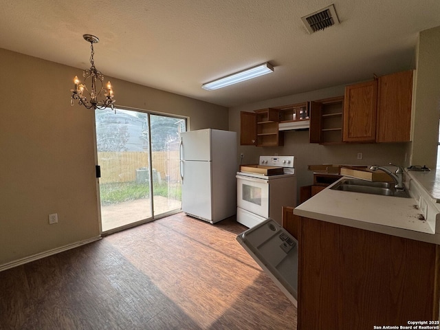 kitchen featuring a sink, white appliances, open shelves, visible vents, and under cabinet range hood