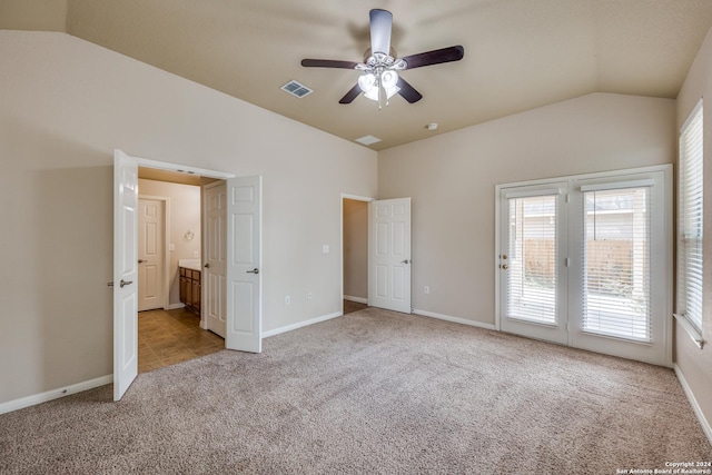 10603 Catfish Ln, San Antonio, TX 78224 - unfurnished bedroom featuring vaulted ceiling, access to outside, carpet flooring, baseboards, and connected bathroom