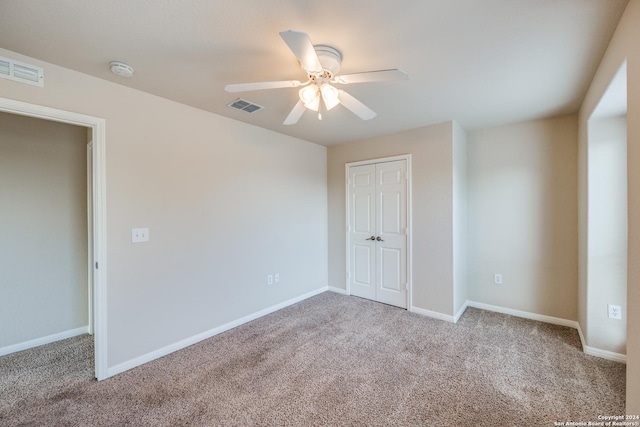 10603 Catfish Ln, San Antonio, TX 78224 - unfurnished bedroom featuring carpet flooring, a closet, and a ceiling fan