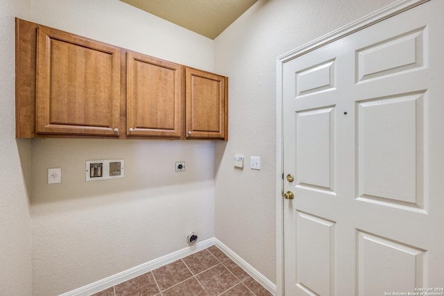 10603 Catfish Ln, San Antonio, TX 78224 - laundry room featuring hookup for an electric dryer, cabinet space, hookup for a washing machine, baseboards, and dark tile patterned flooring