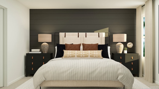 bedroom with light carpet and baseboards