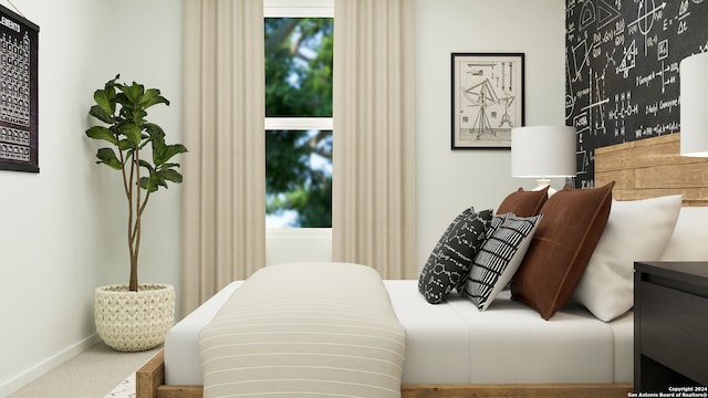 carpeted bedroom with baseboards