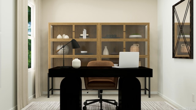 office featuring light colored carpet and baseboards