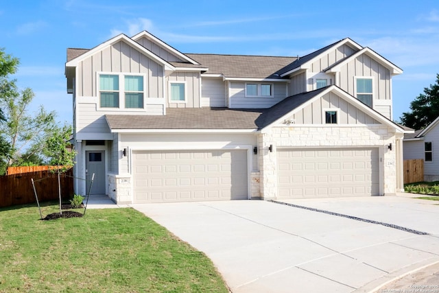 236/238 Joseph Cir, Cibolo, TX 78108 - view of front facade with board and batten siding, stone siding, driveway, and fence