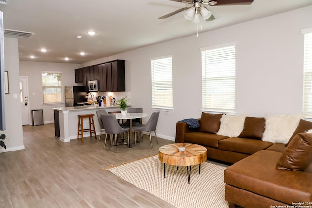 236/238 Joseph Cir, Cibolo, TX 78108 - living room with a ceiling fan, visible vents, baseboards, light wood-style floors, and recessed lighting