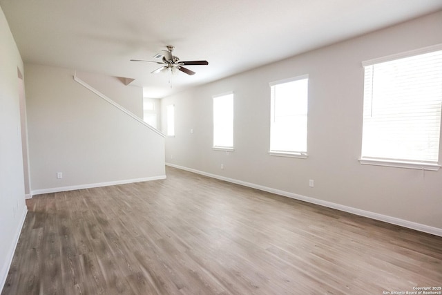 236/238 Joseph Cir, Cibolo, TX 78108 - unfurnished living room with wood finished floors, baseboards, and ceiling fan