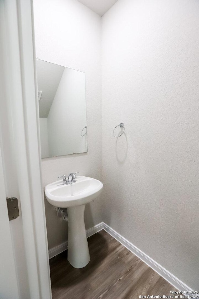236/238 Joseph Cir, Cibolo, TX 78108 - bathroom featuring baseboards and wood finished floors
