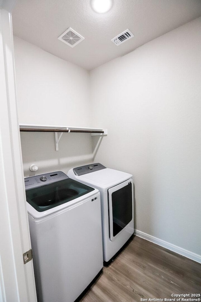 236/238 Joseph Cir, Cibolo, TX 78108 - laundry area with laundry area, visible vents, wood finished floors, and washing machine and dryer