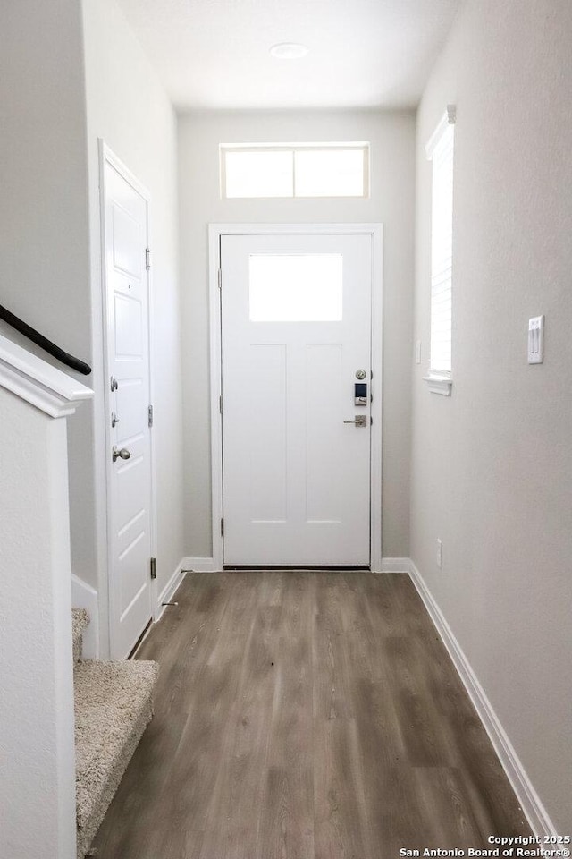 236/238 Joseph Cir, Cibolo, TX 78108 - entryway with baseboards, stairway, and wood finished floors