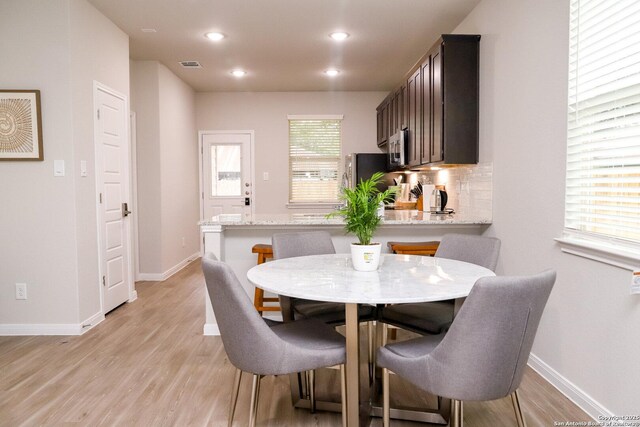 236/238 Joseph Cir, Cibolo, TX 78108 - dining room featuring baseboards, light wood-style floors, and visible vents