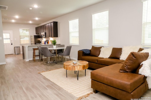 236/238 Joseph Cir, Cibolo, TX 78108 - living area with baseboards, recessed lighting, light wood-style floors, and visible vents